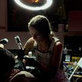 Bobbi tattooing a client